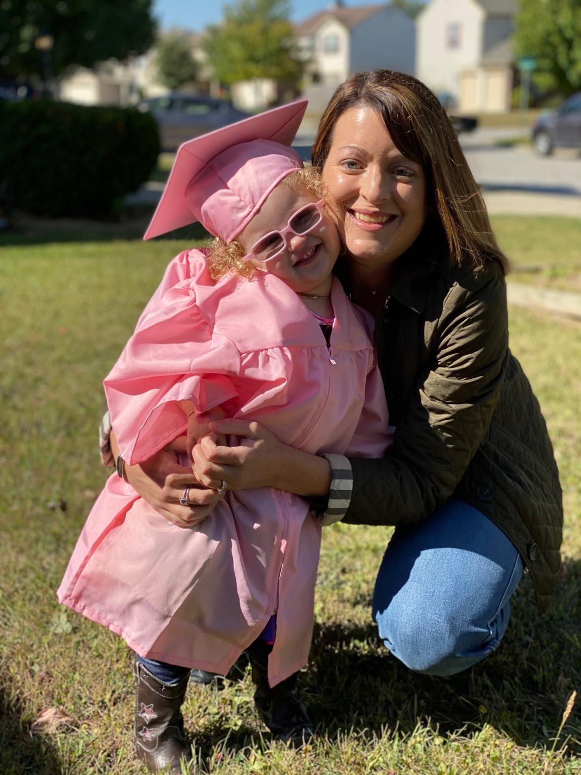 VIP Graduate pics mother with child in grass