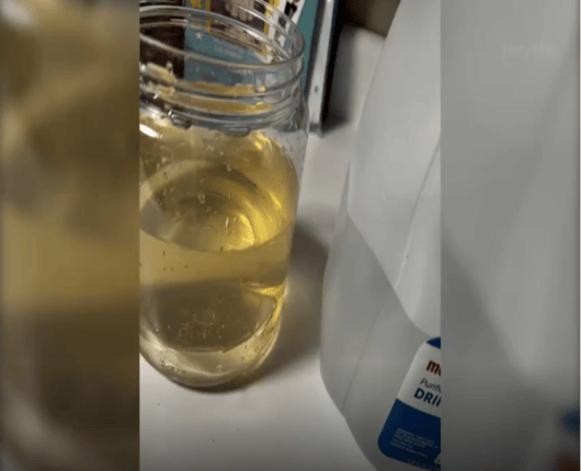 Jar filled with brown water